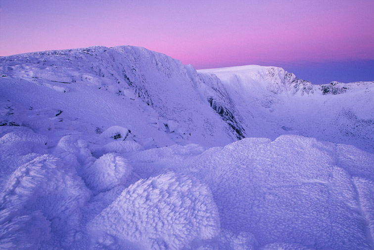Ice-sculpted rocks at dawn, Northern Corries, Grampian Mountains. Cairngorms National Park. Scotland. March. 