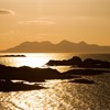 Isle of Rum at sunset viewed from Arisaig, north-west Highlands, Scotland, March 2008